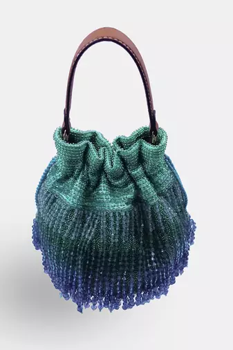 Emerald green potli bag embellished with crystal fringes and a drawstring