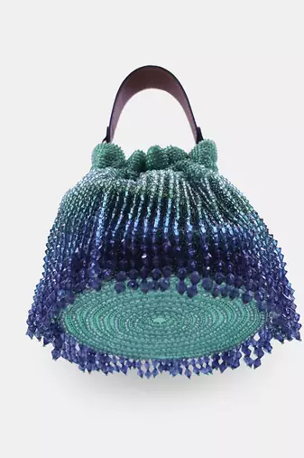 Emerald green potli bag embellished with crystal fringes and a drawstring