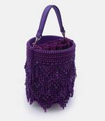 Handcrafted purple potli bag adorned with intricate bead embellished