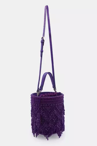 Handcrafted purple potli bag adorned with intricate bead embellished