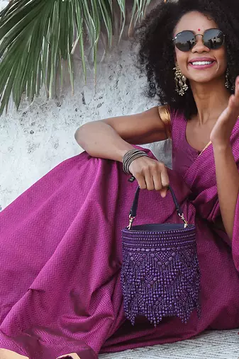 Handcrafted purple potli bag adorned with intricate bead embellished