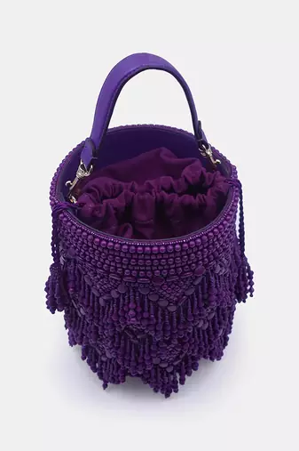 Handcrafted purple potli bag adorned with intricate bead embellished