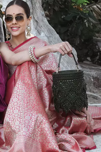 Handcrafted olive green potli bag adorned with intricate bead embellished