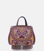 Purple clutch bag embellished with multi-floral beads