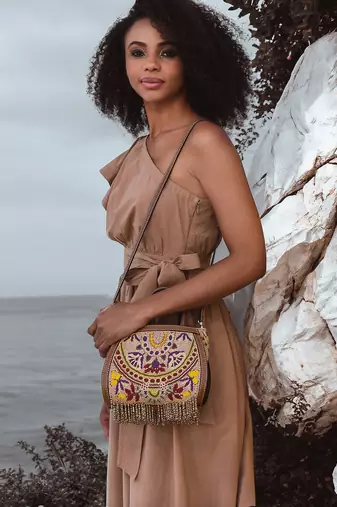 Purple clutch bag embellished with multi-floral beads