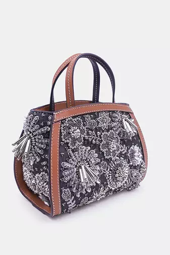 Silver embroidered bead-embellished clutch bag with crossbody strap.