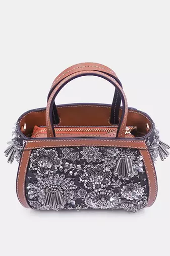 Silver embroidered bead-embellished clutch bag with crossbody strap.