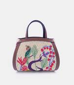 Multi color bead-embellished clutch bag with crossbody strap.