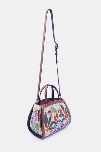 Multi color bead-embellished clutch bag with crossbody strap.