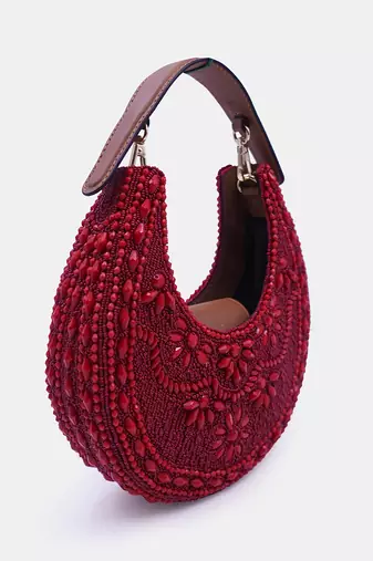 Maroon color embellished clutch bag