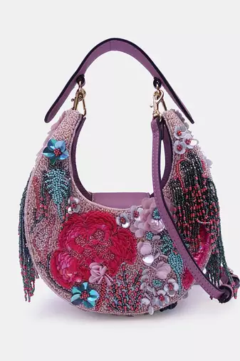 Pink bead-embellished clutch bag with detachable leather crossbody strap