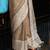Elegant beige woven linen saree with contrast zari border & tassels     soft & breathable party wear