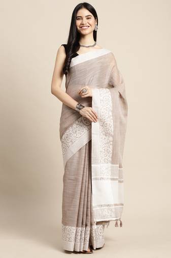  beige woven linen saree with contrast zari border & tassels