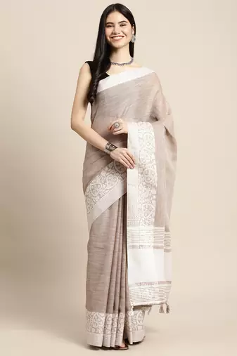  beige woven linen saree with contrast zari border & tassels