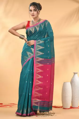 Teal and pink cotton blend saree with ethnic motifs