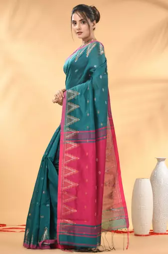 Teal and pink cotton blend saree with ethnic motifs