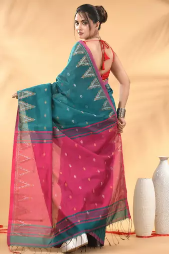 Teal and pink cotton blend saree with ethnic motifs