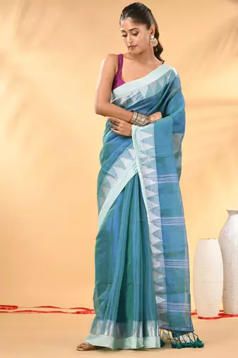 Sea green and white tissue saree with woven geometric border