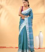 Sea green and white tissue saree with woven geometric border