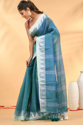 Sea green and white tissue saree with woven geometric border