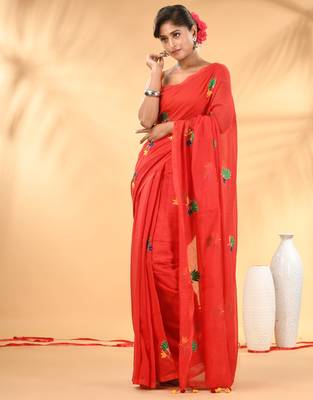 Red mulmul cotton saree with floral embroidery and tassel detailing 1