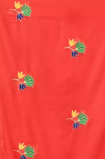 Red mulmul cotton saree with floral embroidery and tassel detailing