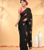 Black mulmul cotton saree with floral embroidery and tassel detailing
