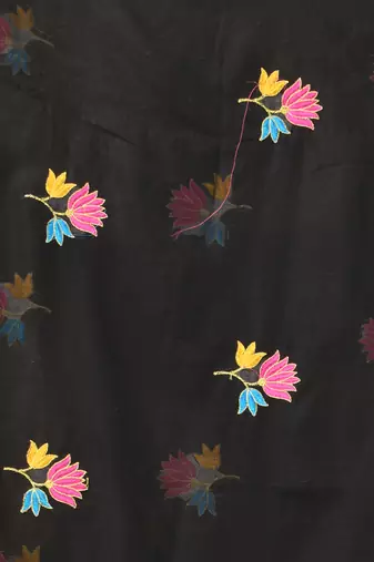 Black mulmul cotton saree with floral embroidery and tassel detailing