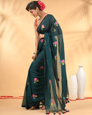 Teal mulmul cotton saree with floral embroidery and tassel detailing 2