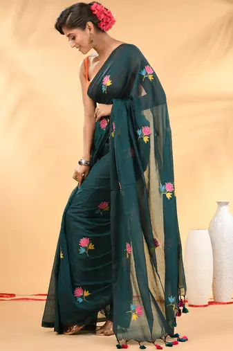 Teal mulmul cotton saree with floral embroidery and tassel detailing