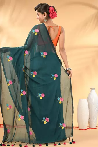 Teal mulmul cotton saree with floral embroidery and tassel detailing