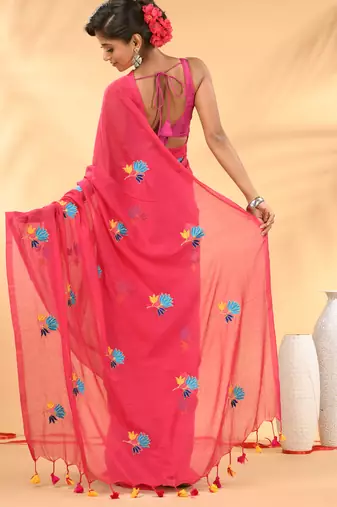 Rani pink mulmul cotton saree with floral embroidery and tassel detailing