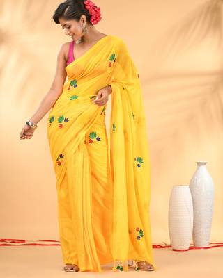 Yellow mulmul cotton saree with floral embroidery and tassel detailing 1