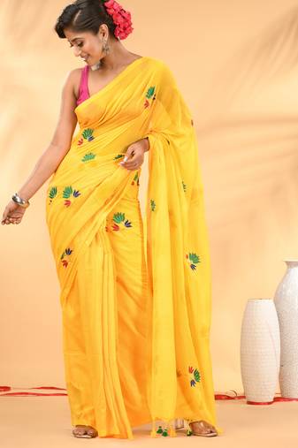 Yellow mulmul cotton saree with floral embroidery and tassel detailing