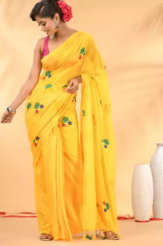 Yellow mulmul cotton saree with floral embroidery and tassel detailing