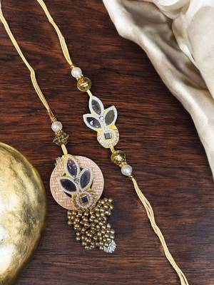 Traditional gold & pearl rakhi – luxurious designer rakhi for brother with
classic craftsmanship 1