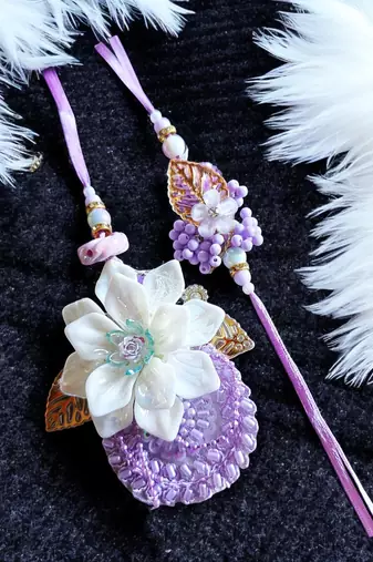Handcrafted purple bloom rakhi for brother - elegant, traditional, and unique
design