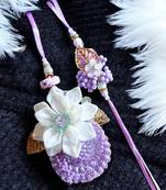 Handcrafted purple bloom rakhi for brother - elegant, traditional, and unique
design