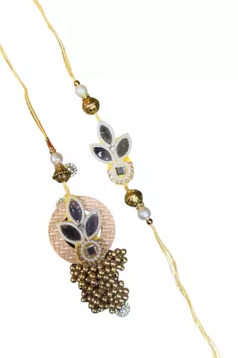 Traditional gold & pearl rakhi – luxurious designer rakhi for brother with
classic craftsmanship