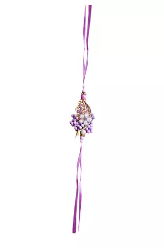 Handcrafted purple bloom rakhi for brother - elegant, traditional, and unique
design