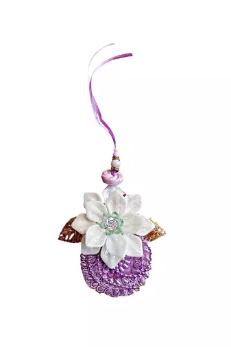 Handcrafted purple bloom rakhi for brother - elegant, traditional, and unique
design