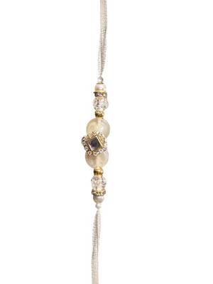 Traditional crystal & pearl rakhi – beautiful gold tassel design for brother and bhabhi 2
