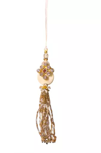 Traditional crystal & pearl rakhi – beautiful gold tassel design for brother and bhabhi