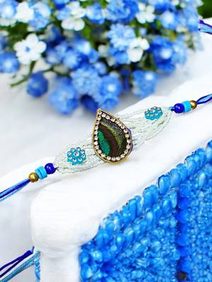 Peacock feather rakhi for brother – traditional handcrafted design with
vibrant colors 1