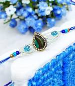 Peacock feather rakhi for brother – traditional handcrafted design with
vibrant colors