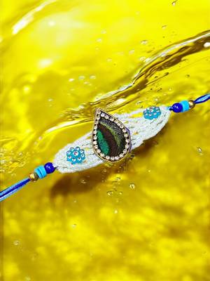 Peacock feather rakhi for brother – traditional handcrafted design with
vibrant colors 2