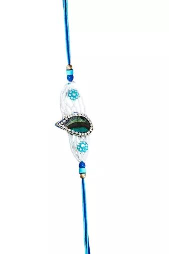 Peacock feather rakhi for brother – traditional handcrafted design with
vibrant colors