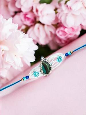 Peacock feather rakhi for brother – traditional handcrafted design with
vibrant colors 4
