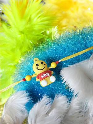 Smiley charm rakhi – fun and playful kids rakhi with bright smiley design 1