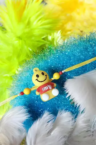 Smiley charm rakhi – fun and playful kids rakhi with bright smiley design